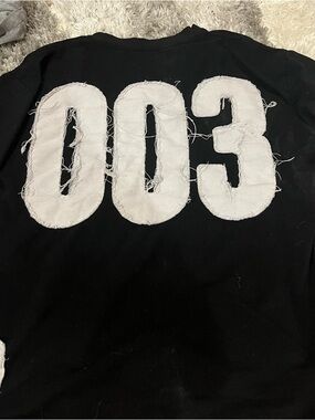 Black Sweatshirt with Distressed White '003' Patch